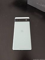 Rear view of Pixel 6a on black surface