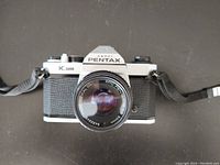 Front view of Asahi Pentax K1000 camera with SMC Pentax-M 50mm f/2 lens mounted