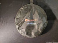 Round black carrying case with 'Dynaphos Model DPL-005XL' branding on top, from amvona.com