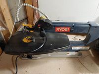 Ryobi SC180VS scroll saw full side view showing machine arm, worktable, power cord, and overall condition.