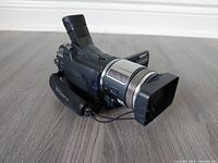 Front side view of Sony HDV Handycam showing lens hood, zoom ring, and hand strap