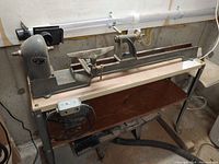 Full view of Beaver lathe mounted on stand, showing headstock, bed and tailstock