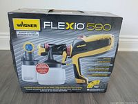 Front of original box showing Wagner Flexio 590 branding and sprayer image