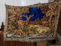 Full view of fabric tapestry showing entire deer woodland scene with detailed trees, plants, and borders.