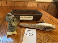 Three vintage items from Bodie Ghost Town and Bodie Flats, NV displayed on wooden surface with information tags and MaxSold lot card.