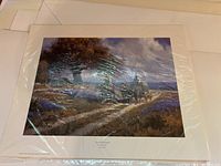Photo of limited edition art print 'Sweet Smell of Spring' by Martin Grelle, numbered 719/750, with signature and number visible under plastic wrap.