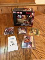 Overview of Riddell 49ers mini helmet in box and four Steve Young cards