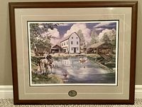 Full view of the framed art print showing the pond scene with buildings, horses, and people.