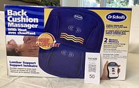 Photo of boxed Dr. Scholl's back cushion massager with heat showing product information and branding.