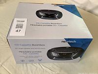 Nexttech branded box showing image and features of the CD cassette boombox