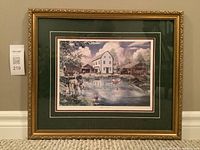 Full view of framed original art print entitled "White's Pond" showing a watercolour scene with buildings and people around a pond.