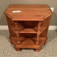 Full frontal view of the solid maple hexagonal end table showing open shelving and turned columns.