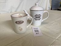 Photo of teapot and cup, showing front Tim Hortons logos and general condition