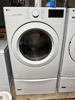 Front view of dryer on pedestal base