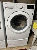 Front view of washer on pedestal base