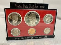 Front view of the 1976 US Bicentennial Proof Coin Set in original casing with six coins displayed on red insert.