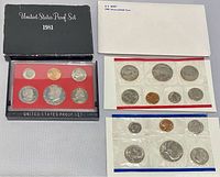 1981 United States Proof Set in original plastic case with slate black cover on back along with two cellophane encased mint coin sets.