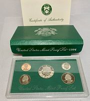 1994 US S Proof Coin Set in clear plastic protective case with green background, framed by green presentation box and certificate of authenticity from United States Treasury.