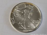 Obverse side showing Lady Liberty walking and date 1999