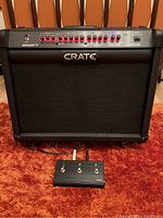 Front view of Crate GLX amp on orange carpet with footswitch placed in front