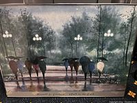 Painting titled 'Walk in the Park' by Russell L. Erickson showing serene park scene with people holding umbrellas and trees in background, in custom frame