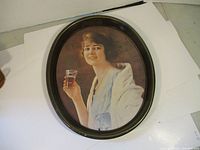 Full view of the vintage oval Coca-Cola tray featuring a young woman holding a Coca-Cola glass