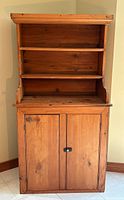 Front view showing hutch top and lower cabinet with doors closed