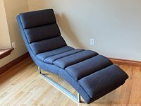 Three-quarter front view showing full chaise lounge silhouette and base