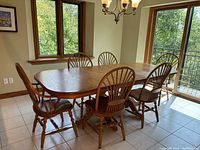 Dining table with six chairs assembled, table extended