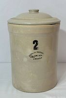 Front view of beige stoneware pickling crock showing number '2' and Medalta Pottery stamp.