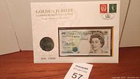 Golden Jubilee Commemorative Cover displaying a £5 Bank of England banknote with Queen Elizabeth II and a crown coin.