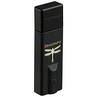 Front angle photo of the Audioquest DragonFly Black digital-to-analog converter, showing gold dragonfly logo and USB connector end covered by cap