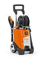 Front view of orange and white STIHL RE 130 Plus pressure washer with hose reel, spray gun, wheels and handle.