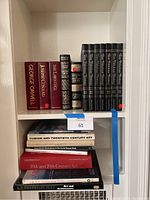 Shelf showing vintage and classic hardcover novels including George Orwell, Joseph Conrad, D.H. Lawrence, Herman Melville's Moby Dick, Sherlock Holmes, and the 8-volume set 'This Fabulous Century'.