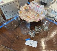Overview of all items including ceramic flower bowl with checkered floral pattern, 3 glass vases, and 2 glass candleholders