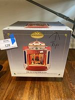 The original Gold Label box featuring the Nutcracker Suite music box image and marking the top for orientation.