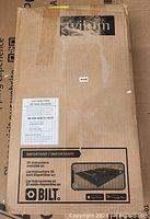 Photo of the closed cardboard packaging box with the label 'viltum' and instructions about 3D assembly via BILT app.