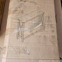 Boxed Convenience Concepts Oxford Console Table with packaging showing wear and tape from shipping.