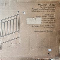 Box showing brand, model number WM3151TW-TYF, product name Twin Metal Headboard, size 39.5 in x 49.25 in height, net weight 11.11 lb.