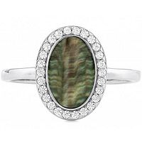 Close-up of an oval mother of pearl ring with clear stones halo set in sterling silver.