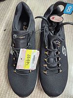 Pair of black Skechers sport shoes for women, size 8, brand tag and price tag visible