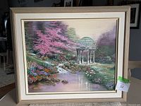 Full view of the painting showing a garden scene with a stream, gazebo, and trees.
