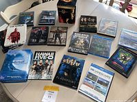 Full view of all DVDs and Blu-rays on table showing cover art