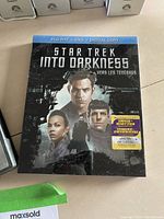 Star Trek Into Darkness Blu-ray, DVD and Digital Copy case featuring main characters, sealed with a sticker.