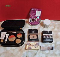 Full lot showing compact makeup palette, Lash Tape, Unicorn Snot gel, Elf eyeshadows and primer trio, Colourpop eyeshadows