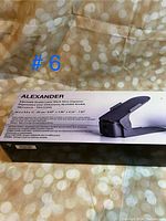 Photo showing the Alexander shoe organizer box front with product image and dimensions