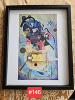 Framed abstract colorful print with different angles showing condition and content clearly