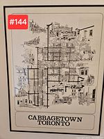 Front view of the framed hand-drawn black and white art map titled 'Cabbagetown Toronto' showing the full artwork, including streets and illustrations.