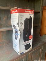 Front view of Honeywell Enviracaire tower air purifier box showing product image and brand.