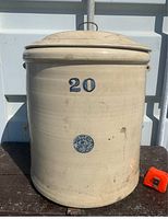 Front view of large 20-gallon beige salt glaze stoneware crock with lid. Shows large blue number '20' and blue Medalta mark on the front.
